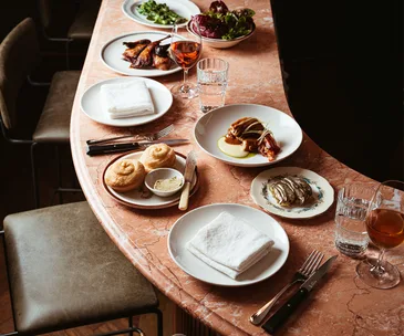 Bar Heather Byron Bay red marble bar and dishes and wine 