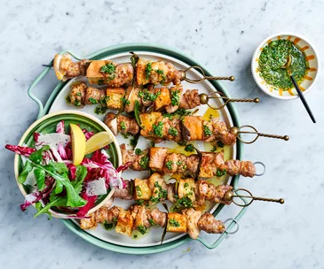 Italian sausage skewers on platter