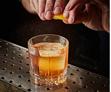 Best whisky glasses Australia shown with an old fashioned cocktail in a whisky glass