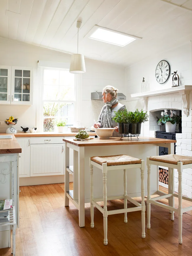 White and timber country style kitchen featuring Ikea cabinets.