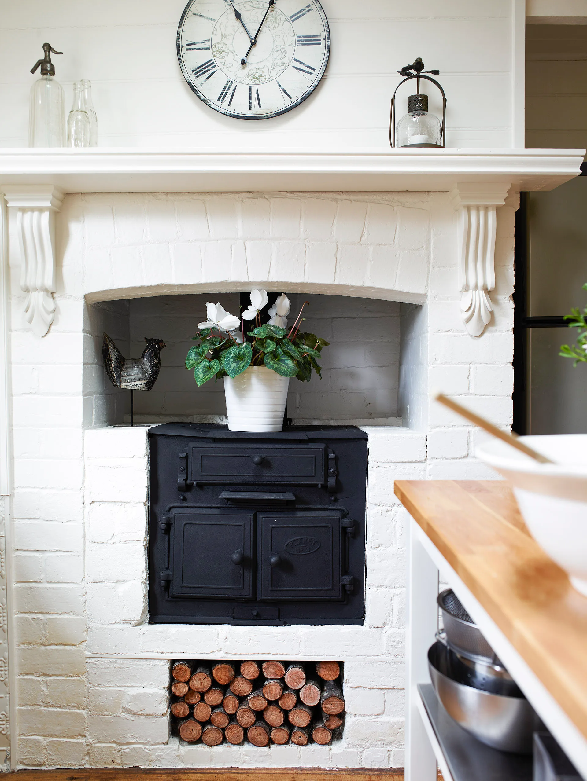 Wood burning stove in a renovated cottage kitchen.