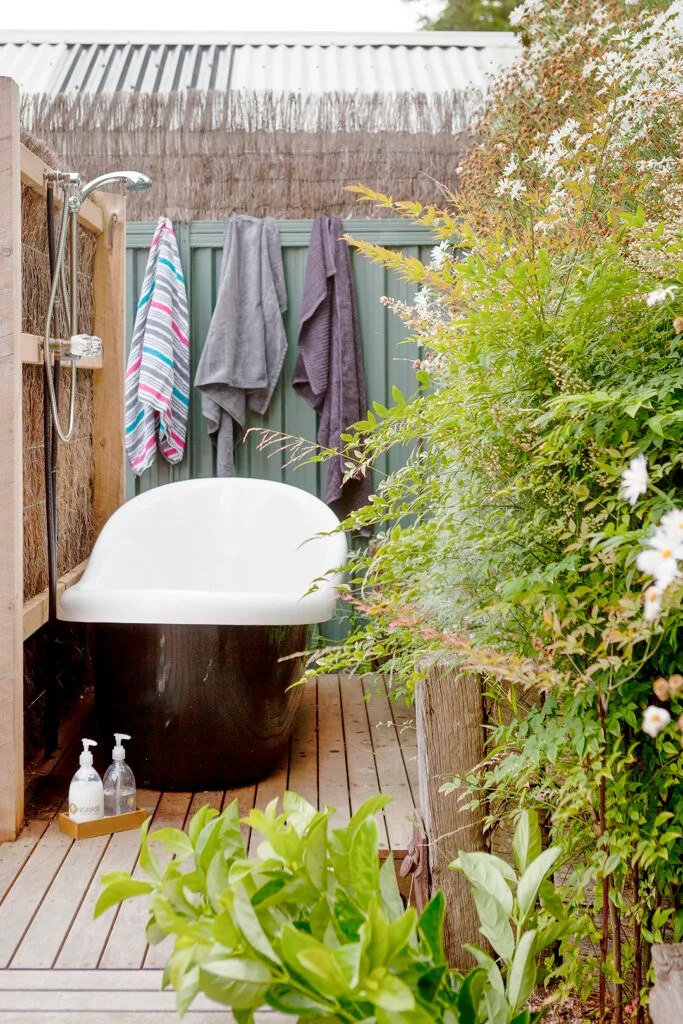 Outdoor bathtub on deck of a coastal weekender.