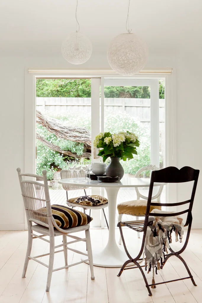 White dining room in a coastal style weekender.