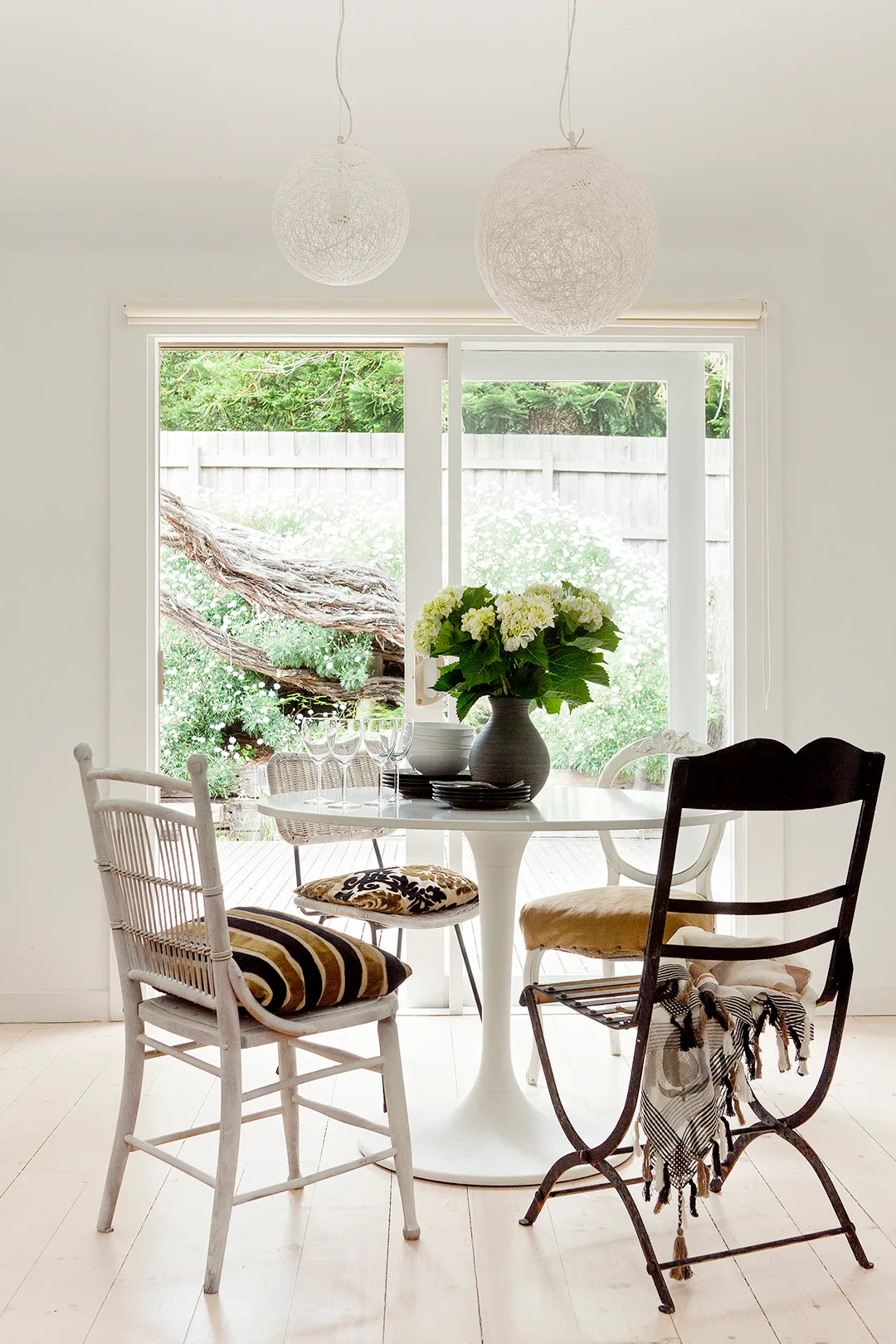 White dining room in a coastal style weekender.