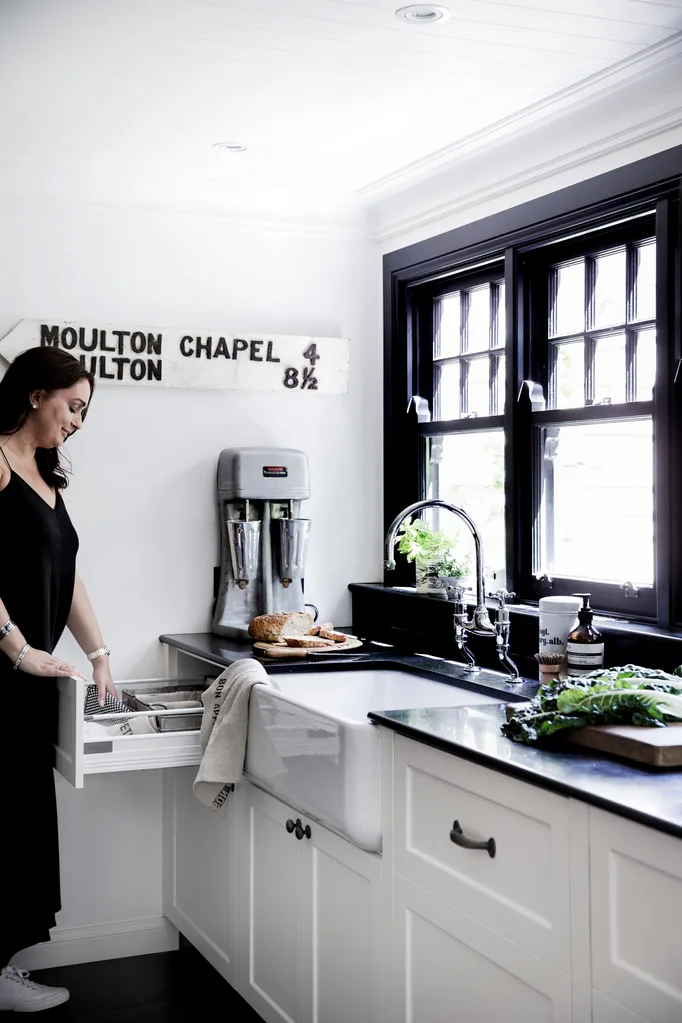 Leanne Carter-Taylor of Quintessential Duckeggblue in her black and white kitchen with vintage style.