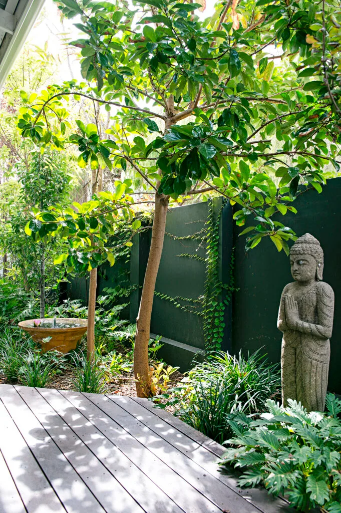 Shaded garden deck with statue