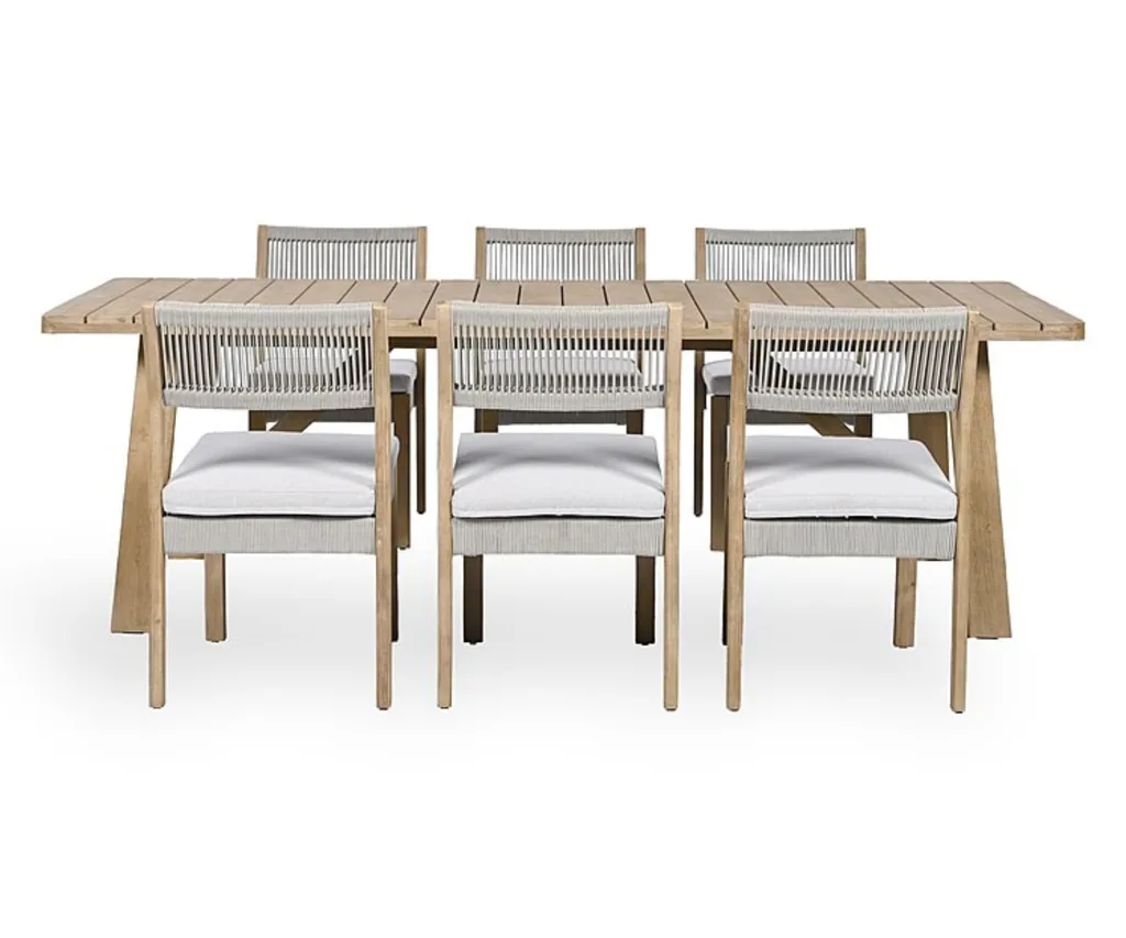 A seven piece outdoor dining set with an outdoor dining table and six outdoor dining chairs with rectangular and square shapes