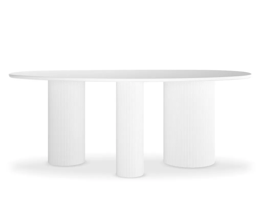 A white concrete outdoor table with three legs and a round top