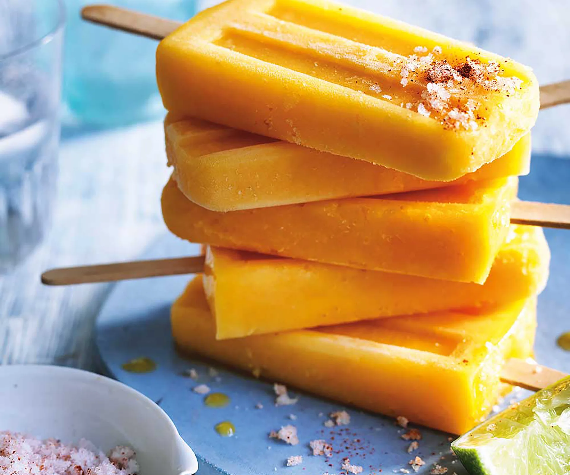 Stack of homemade mango popsicles