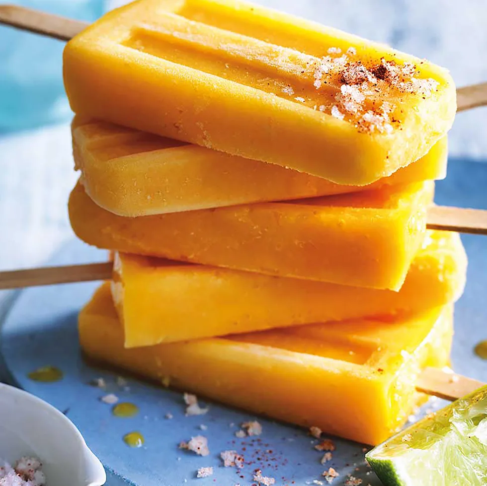 Stack of homemade mango popsicles