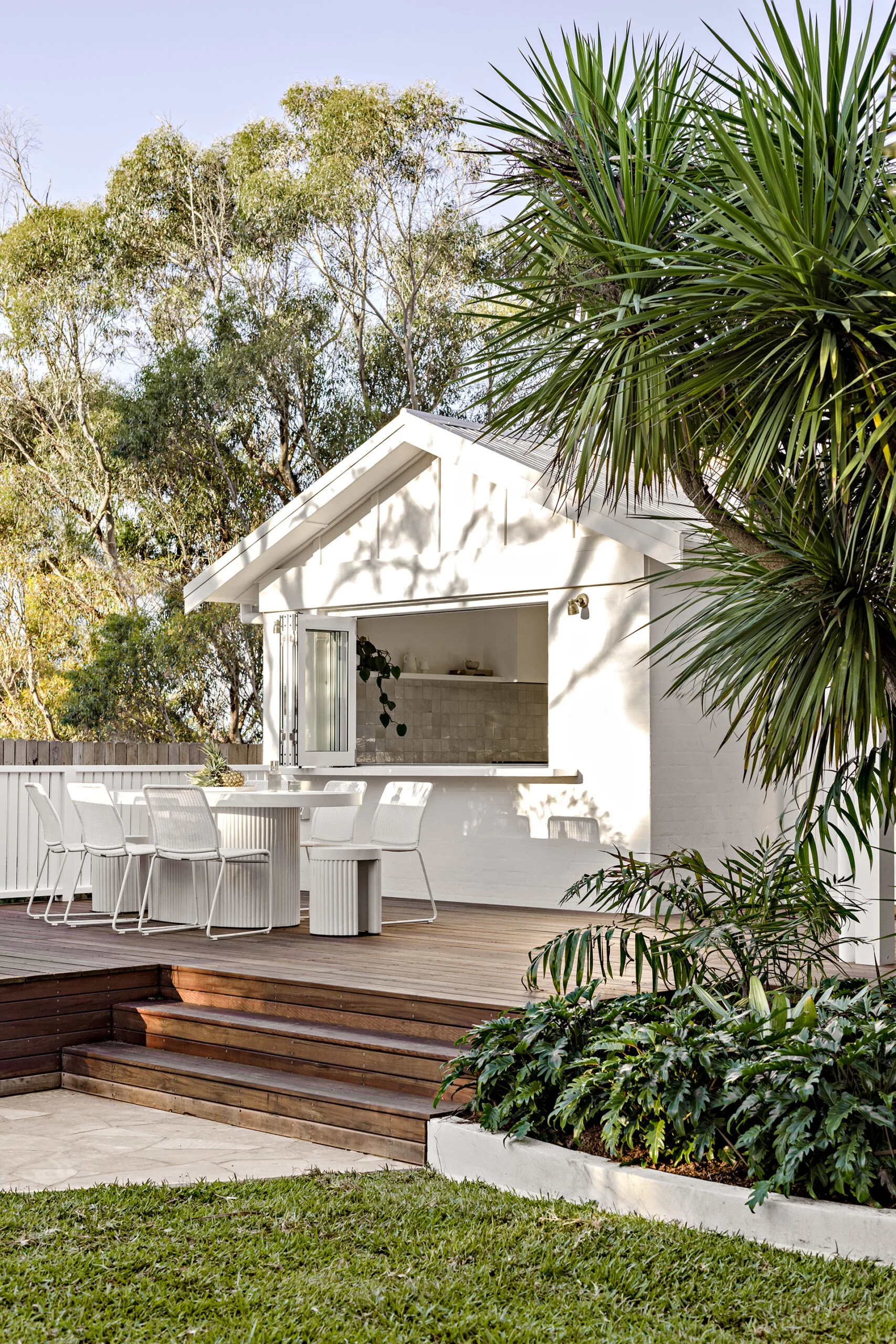 Beach house rear deck on raised level with alfresco dining area.