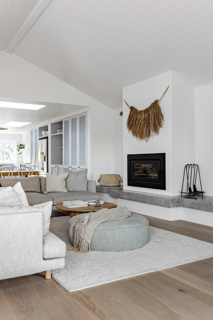 White and concrete living room in a beach house.