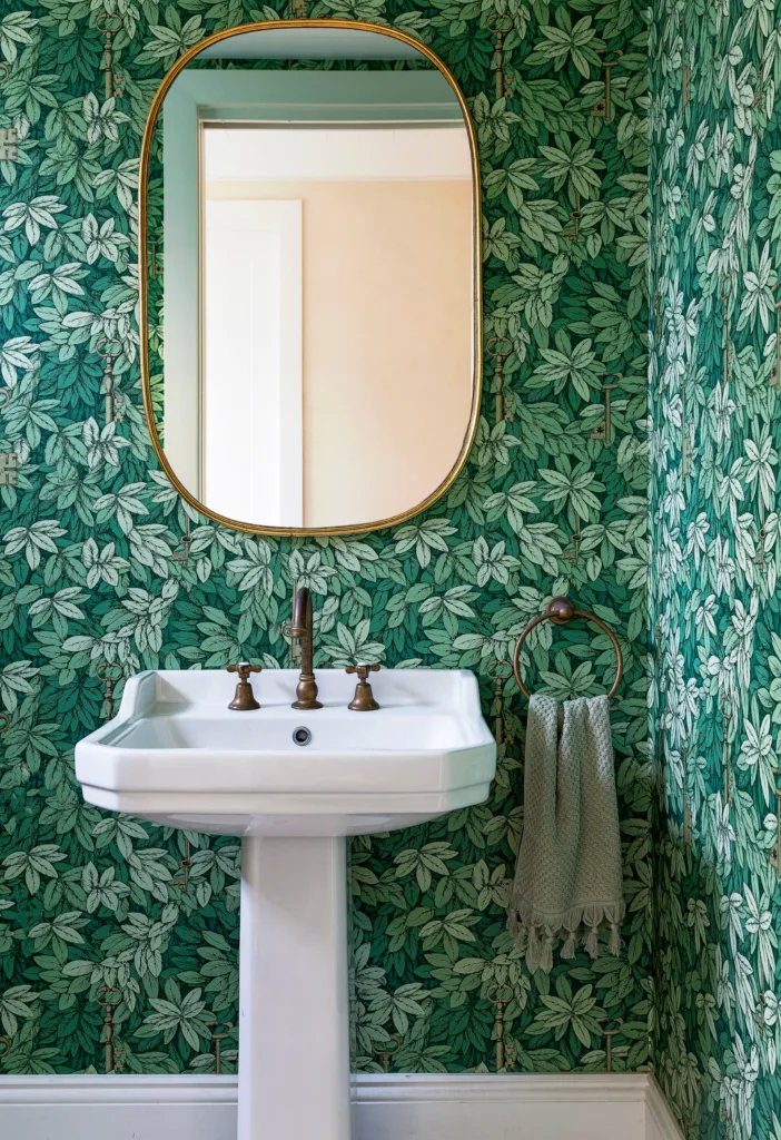 Green leaf wallpapered powder room ideas with pedestal basin