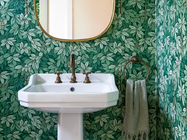 Green leaf wallpapered powder room ideas with pedestal basin