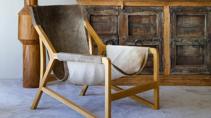 second hand furniture with brown vintage armchair in the forefront