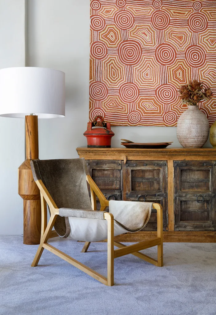second hand furniture with brown vintage armchair in the forefront