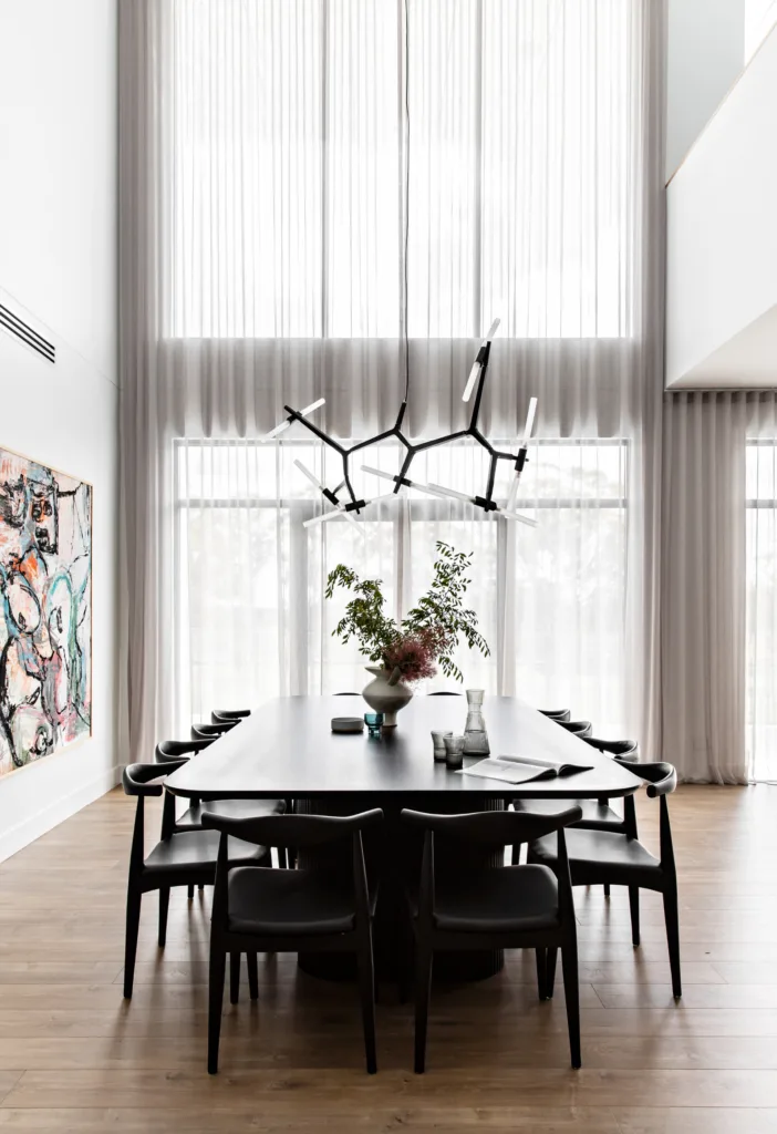 Modern dining room with double height ceilings.