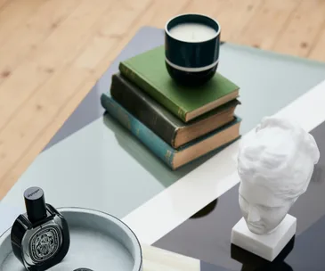 Candle on top of a stack of books