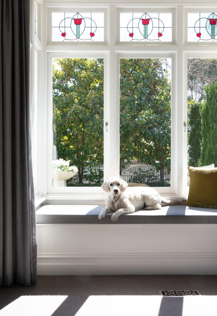 Stained glass above a window seat.