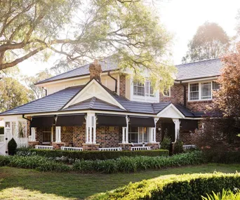 Outdoor transformation: a tired brick home is now a Hamptons dream