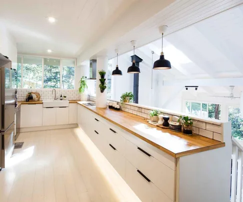White and Scandi-style IKEA kitchen with timber bench top