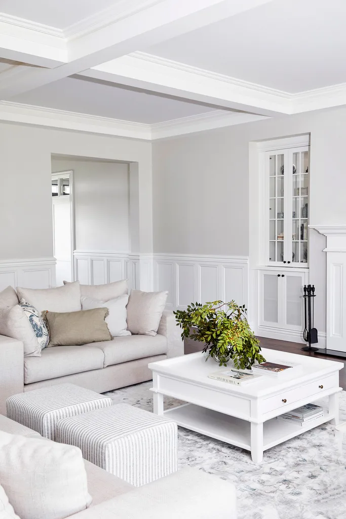 White and beige Hamptons style living room with coffered ceiling.