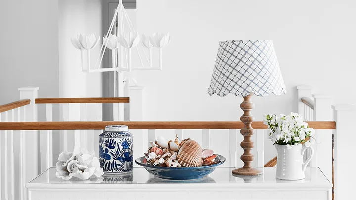 A cordless table lamp is part of the decor.