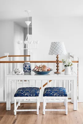 A cordless table lamp is part of the decor.