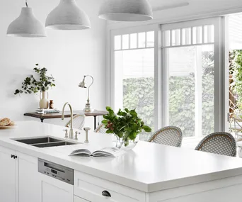 Hamptons kitchen with island bench and pendant lighting