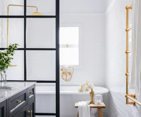 black-framed-shower-screen-with-brass-tapware