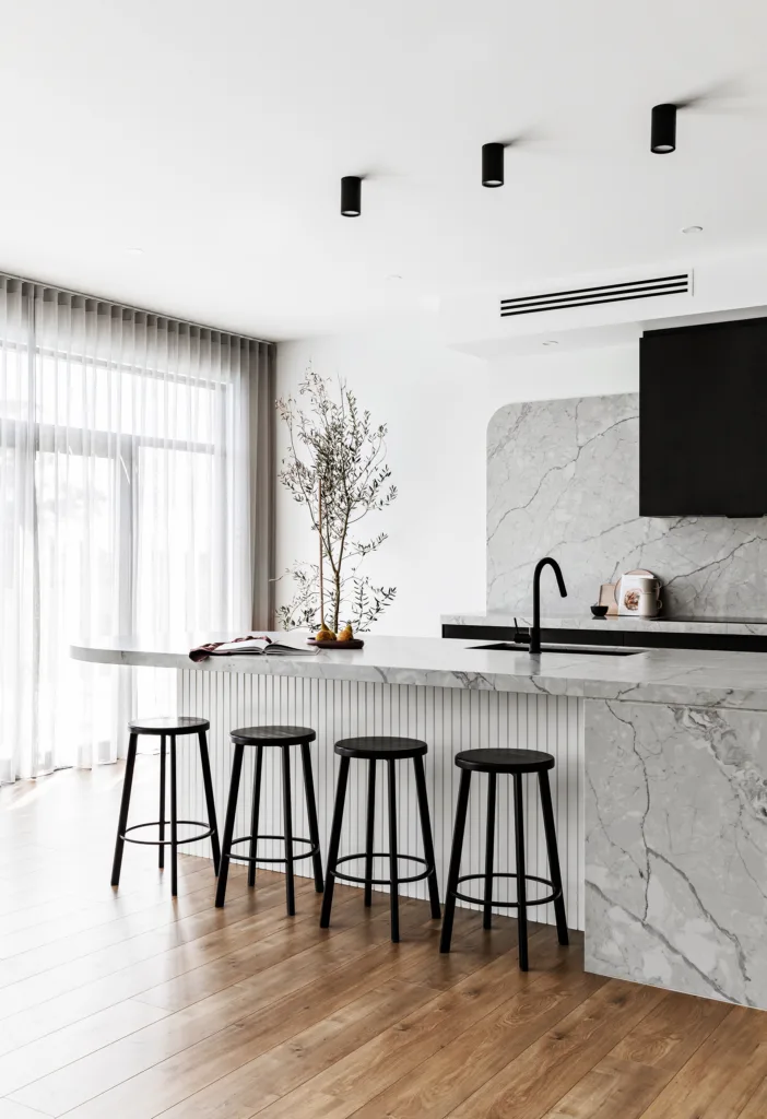 modern grey marble kitchen with black downlights