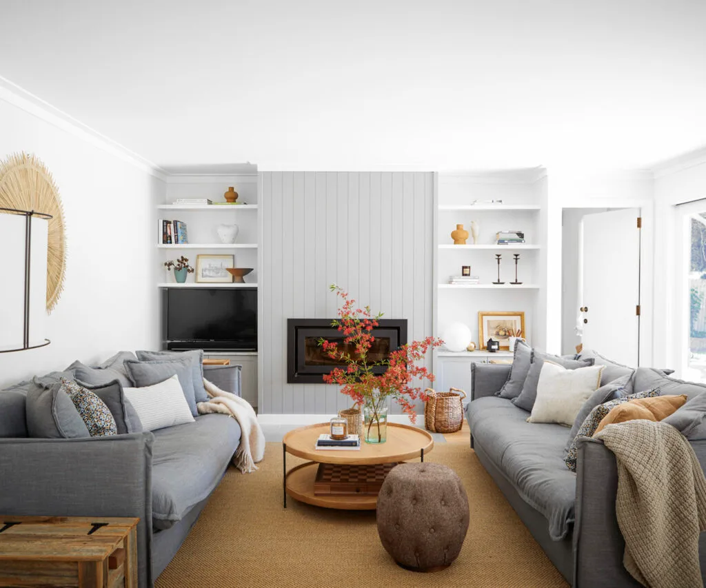 LIVING AREA This is one of Annelise's favourite rooms. "It's a perfect space for the family to come together and watch movies, or for guests to relax in before and after dinner," she says. The Coast to Country Custom Furniture sofas are ideal for sinking into after a long day, and have been paired with Walter G cushions, a custom rug from The Maine House, coffee table from Trit House and 'Puspa' wall hanging from The Dharma Door. A crackling fireplace from Highland Fires & BBQs earns its keep in winter. For a similar floor lamp, try Fat Shack Vintage. The artworks were vintage finds.