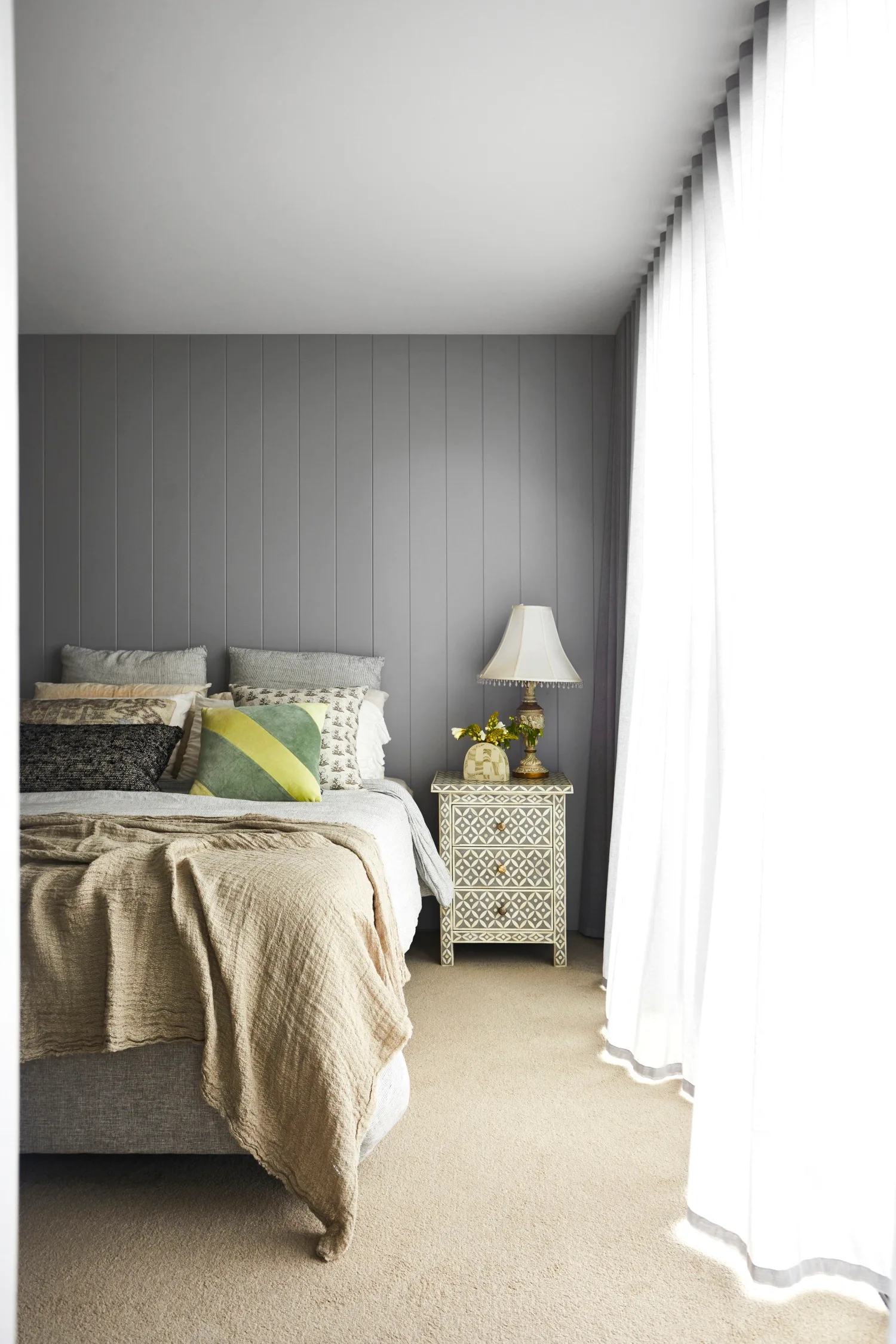 bedroom with grey feature wall
