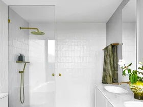 ensuite with white wall tiles and grey marble floor