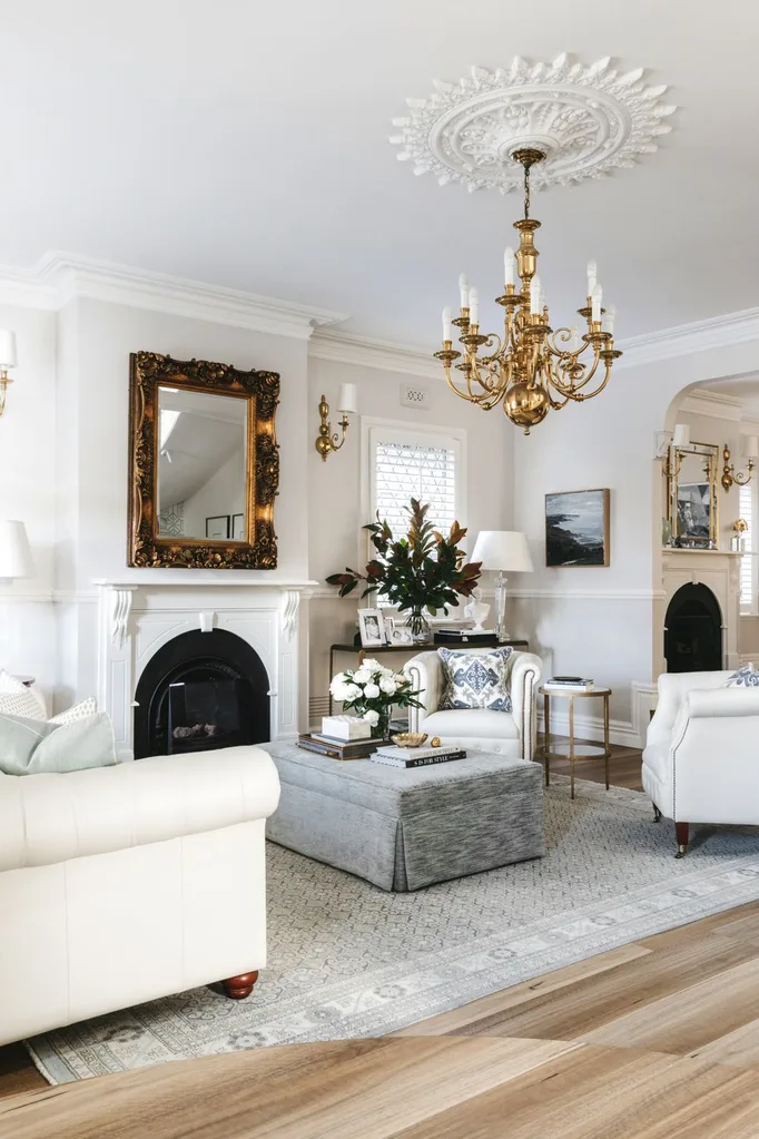 white living room with chandelier