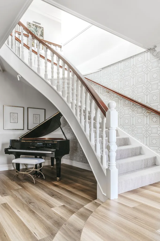 white staircase with grey wallpaper