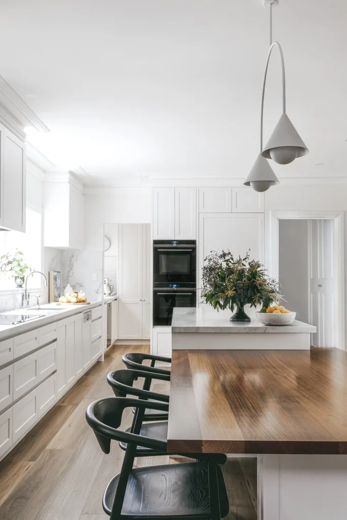 white kitchen with grey pendants