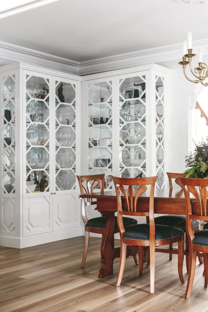 dining area with white built in cabinets