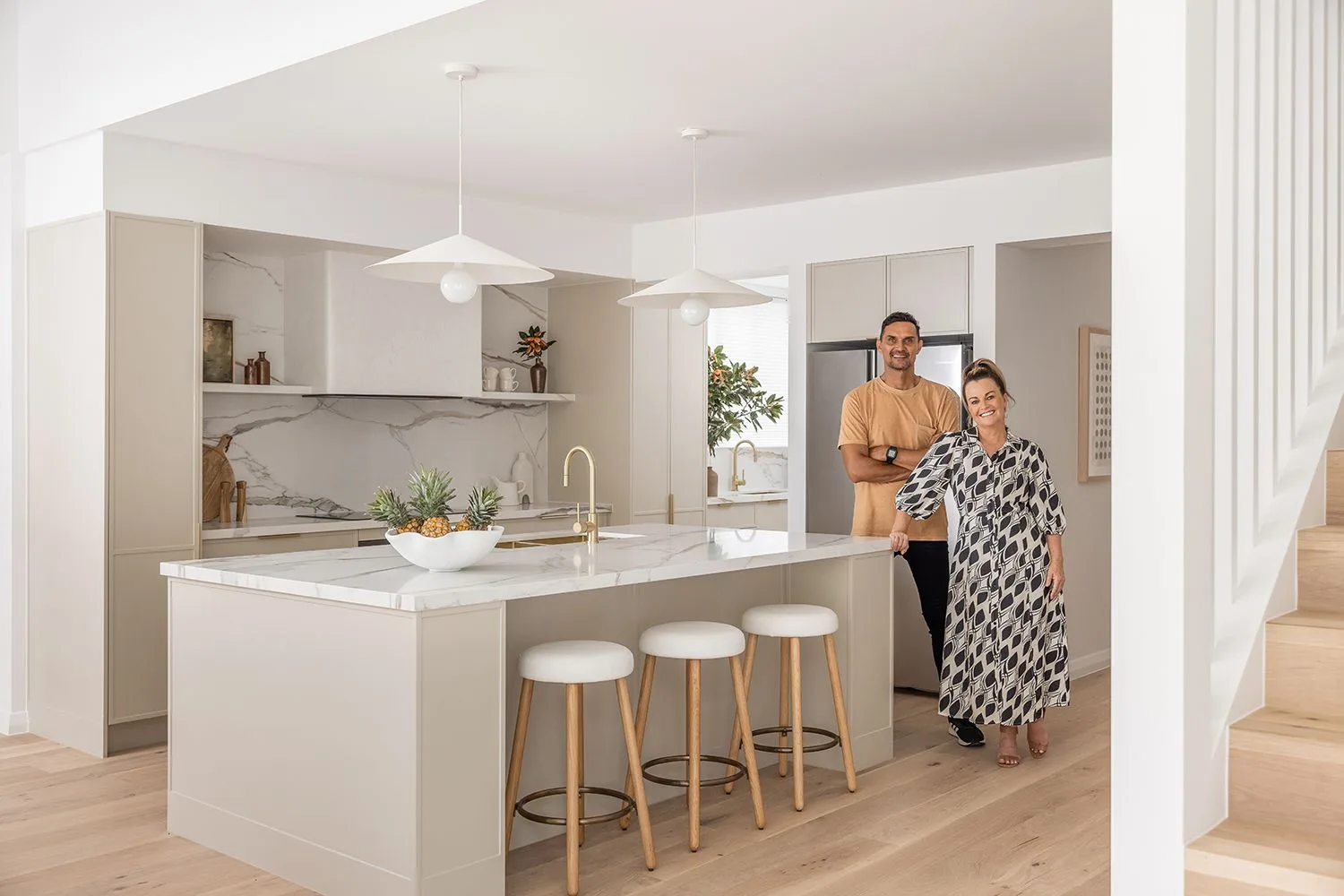 Andy and Deb standing in the kitchen of house 2