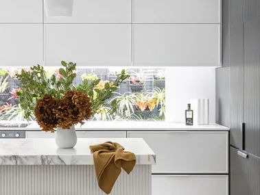 Modern dual tone kitchen with white cabinets