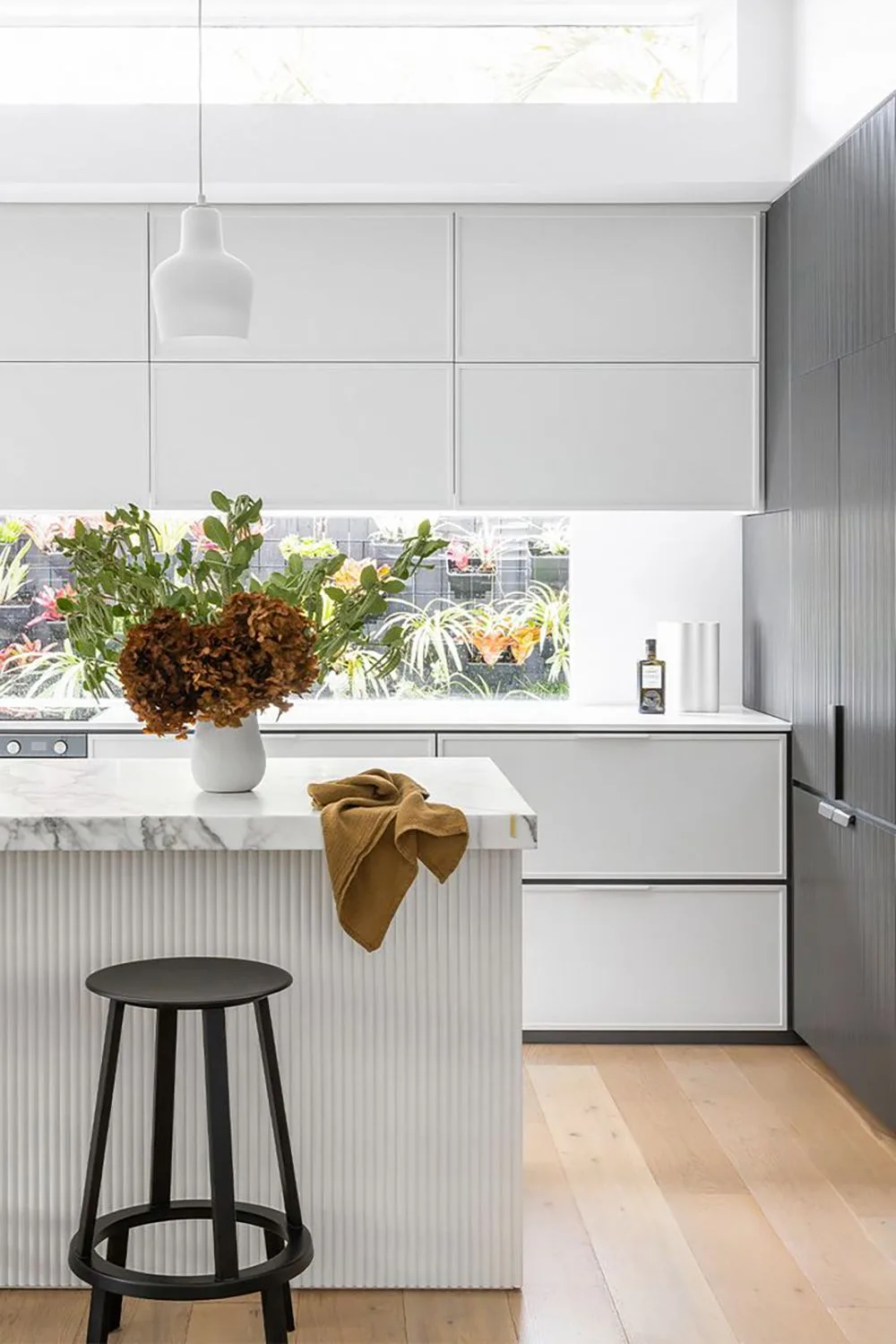 Modern dual tone kitchen with white cabinets