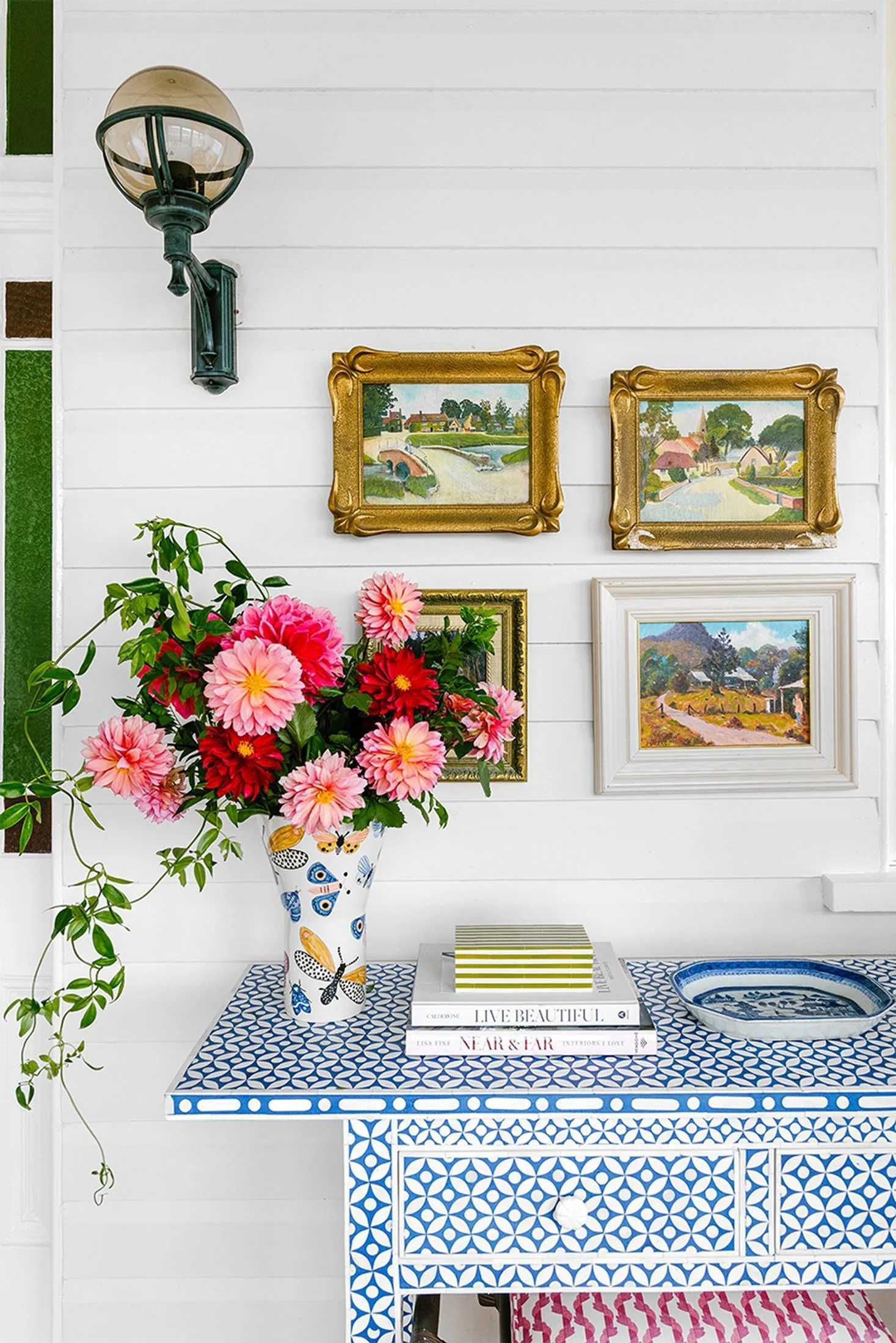 Colourful bone inlay console table and gallery wall