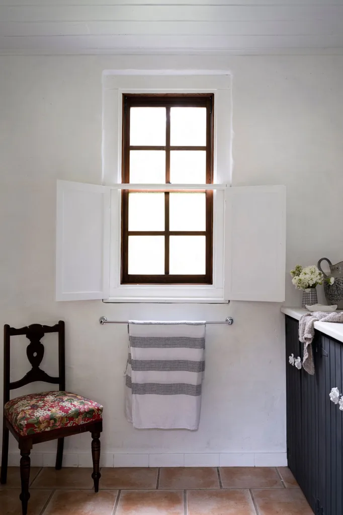 Heritage bathroom with vintage chair
