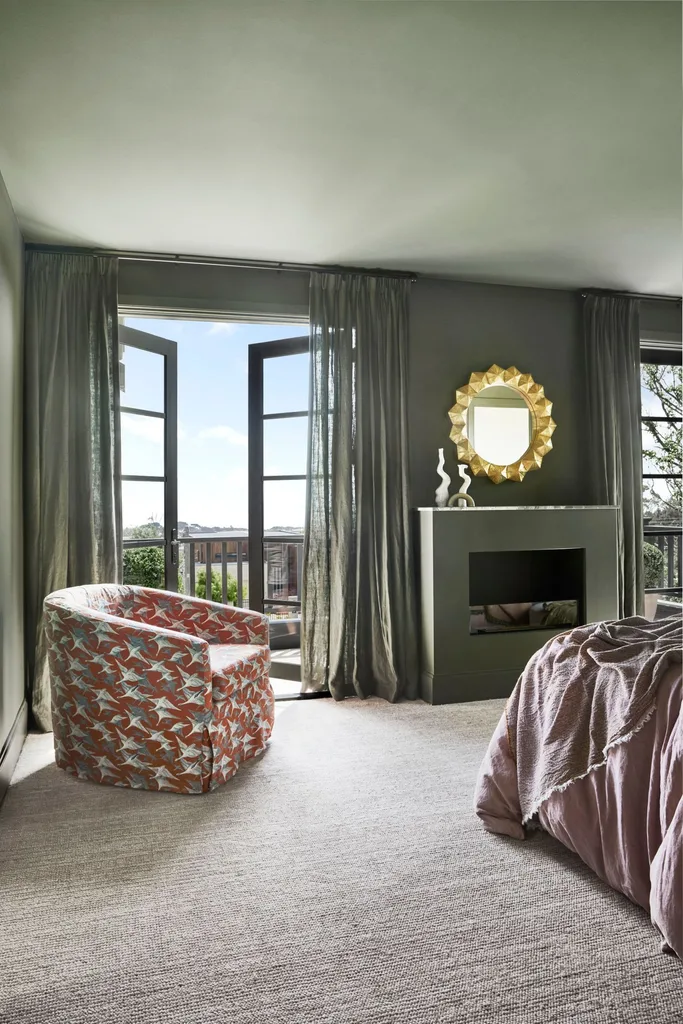 green bedroom with fireplace
