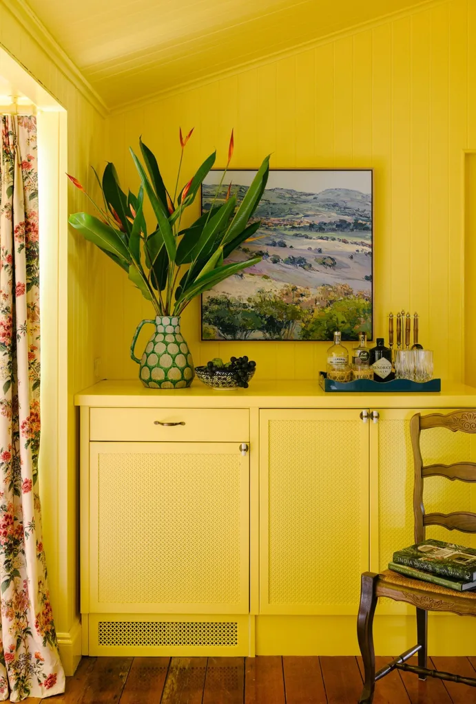 yellow room with sideboard