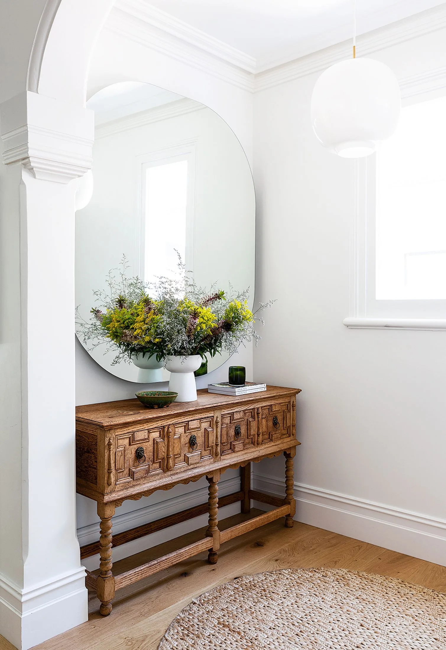 Scented candle on console in home entrance