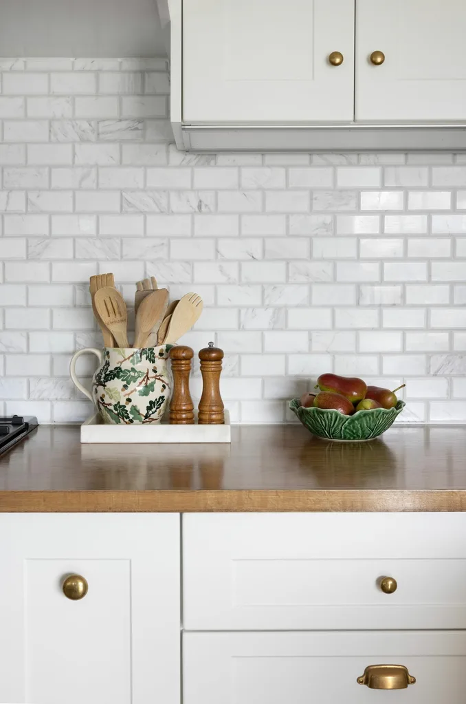 kaboodle kitchen with wooden benchtop and white cabinetry