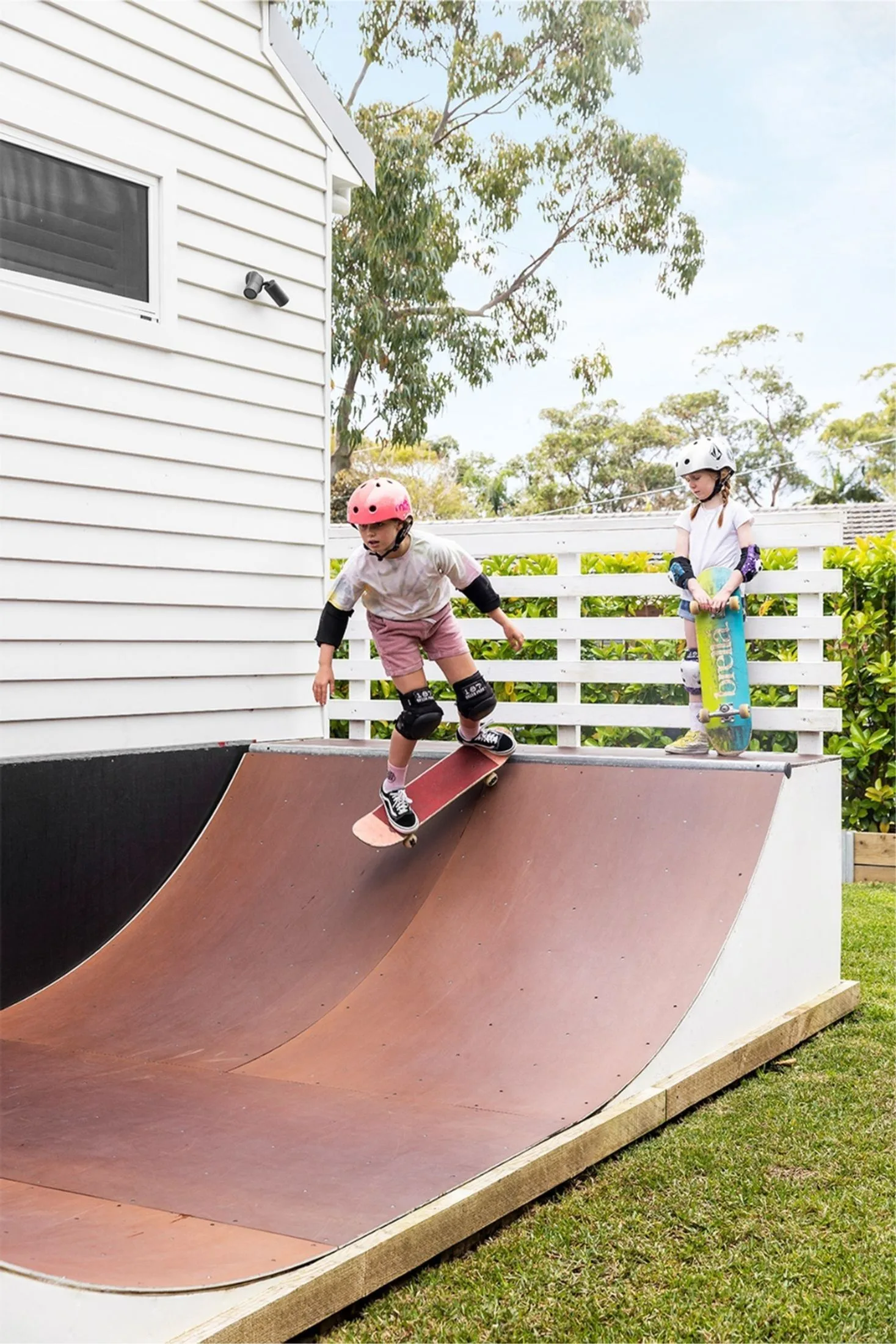 Large backyard with kids skate ramp