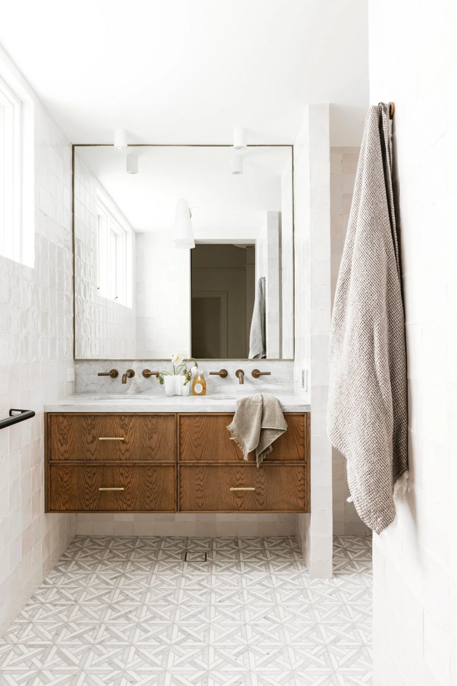 Bathroom with geometric tiles and a timber double vanity