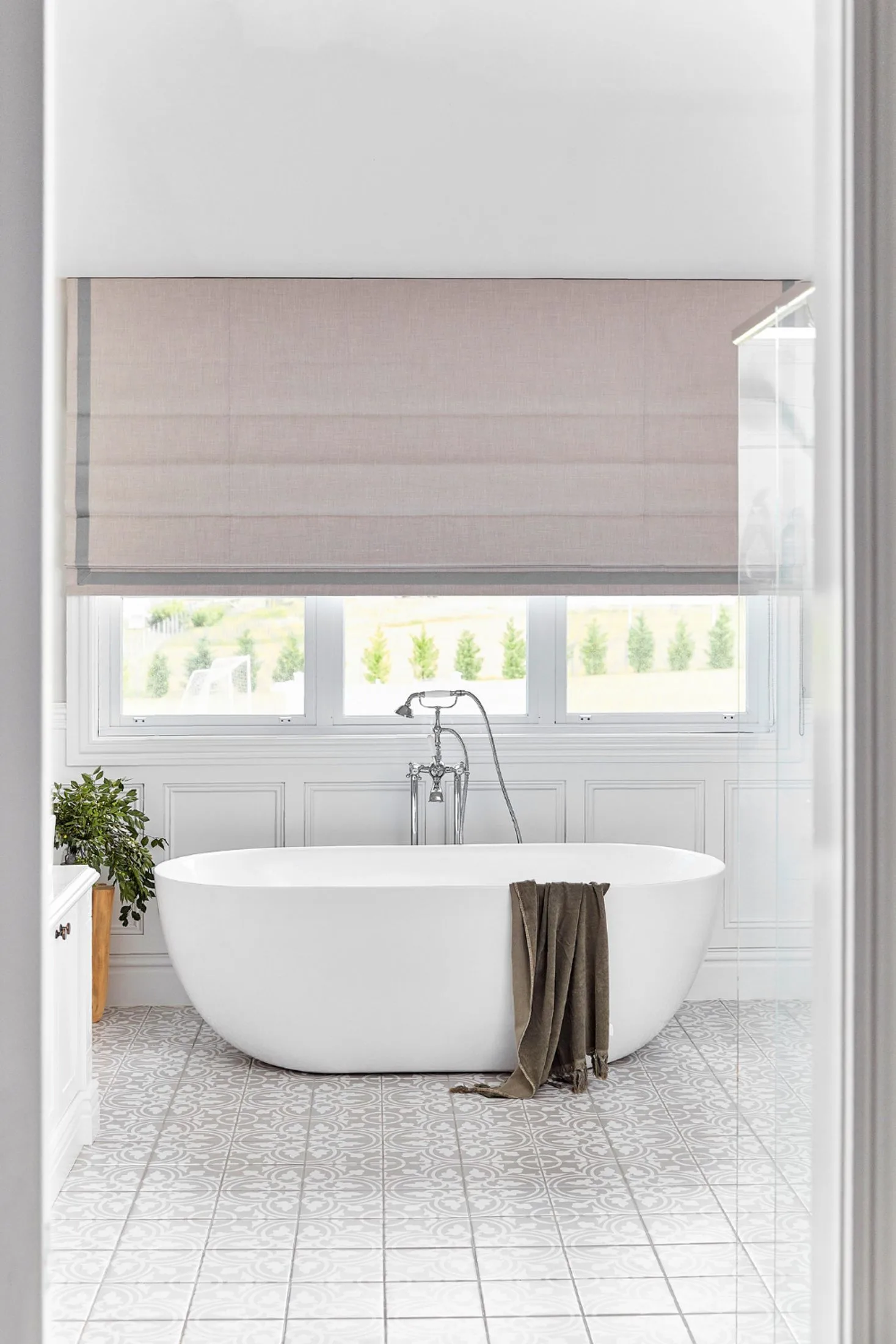 Large bathroom with a freestanding bath, Victorian bath filler and wainscoting